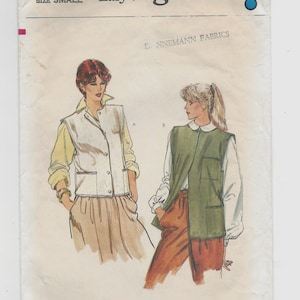 May include: Vintage Vogue sewing pattern featuring two vest designs. The pattern includes a white vest with pockets and a green vest with a collar. The pattern is labeled "Very Easy Vogue" and "Size Small."