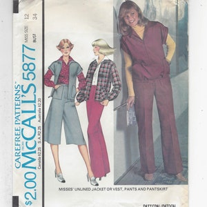 May include: A sewing pattern for a women's unlined jacket or vest, pants, and pantskirt. The pattern is from McCall's and the number is 5877. The pattern is for sizes 12 and 34.