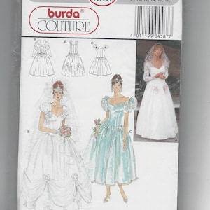 May include: Burda Couture sewing pattern number 4587 for a wedding dress. The pattern includes three different styles: a white dress with a full skirt and a sweetheart neckline, a blue dress with a full skirt and a sweetheart neckline, and a white dress with a full skirt and a scoop neckline. The pattern includes sizes 34 to 44 and 8 to 18.