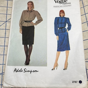 May include: Vogue Patterns sewing pattern featuring designs by Adele Simpson. The cover shows illustrations of a woman in a skirt suit and a dress. The pattern number is 2767. The Vogue Patterns logo is at the top.
