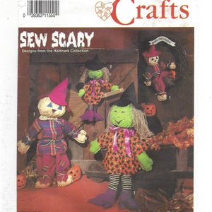 May include: A Simplicity Crafts sewing pattern titled "Sew Scary" featuring designs from the Hallmark Collection. The pattern includes instructions for making Halloween-themed dolls, including a scarecrow, a witch, and a wreath with a scarecrow.