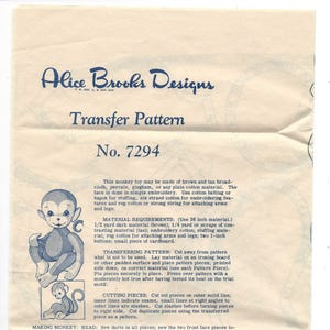 May include: Vintage Alice Brooks Designs transfer pattern for a monkey toy, featuring instructions and a detailed illustration of the finished product. The pattern is labeled No. 7294.