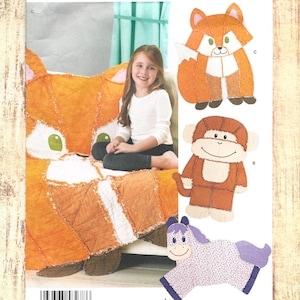 May include: A Simplicity sewing pattern envelope 8278 featuring illustrations of three stuffed animal designs: a fox, a monkey, and a horse. The cover displays a large orange and white fox quilt, a child, and the text Simplicity 8278 U.S. ONE SIZE.