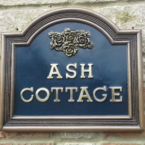 House Name Signs.Bronze and pewter finishes.Red, Black & Blue Backgrounds.Roses motif add 16 letters in the name of your choice.