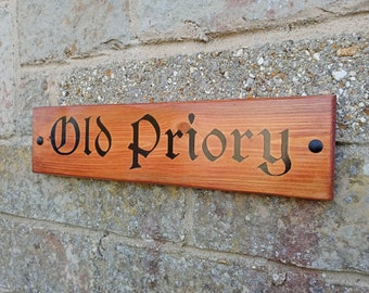 House name signs handcrated from recycled timber with coloured inlaid text.