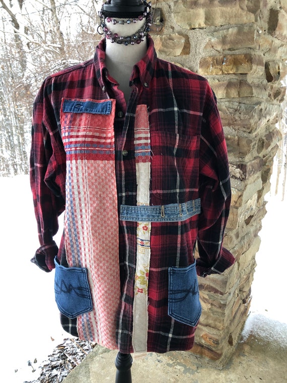 jeans with three red stripes on back pocket