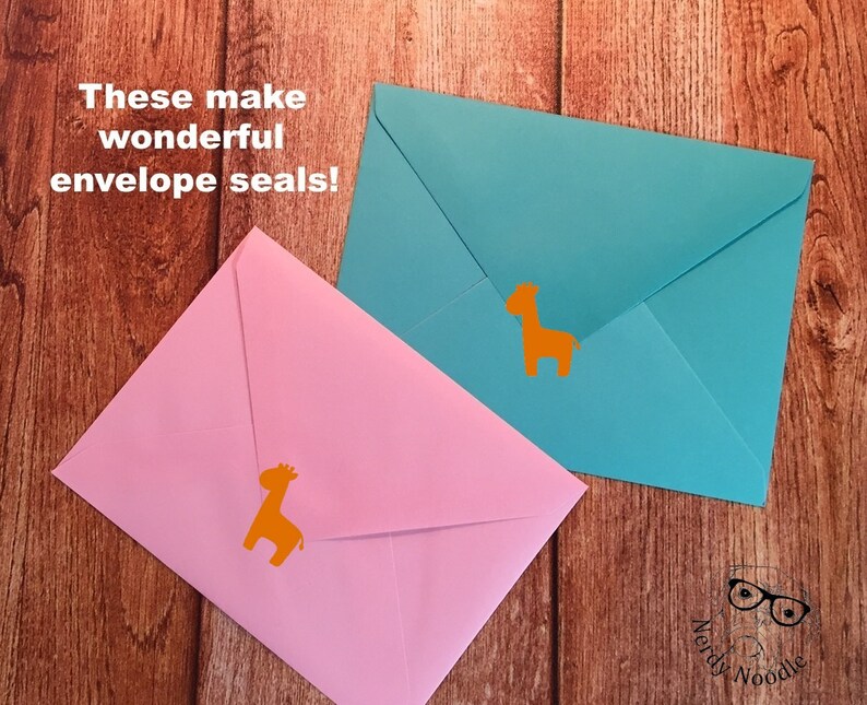 May include: Two envelopes with orange giraffe stickers on them. The text "These make wonderful envelope seals!" is in the top left corner of the image.