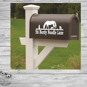 May include: A brown mailbox with a white vinyl decal featuring a horse, two dogs, a cat, and the text "56 Nerdy Noodle Lane".