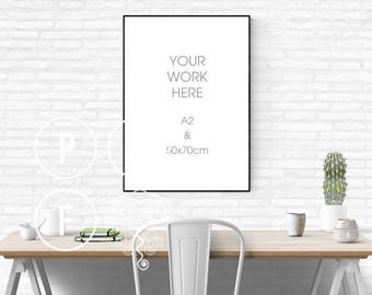 Download Free black poster frame mockup 50x70, A2 mockup, white brick wall, white subway tile, thin frame, styled stock photo, desk scene, cactus, green PSD Template