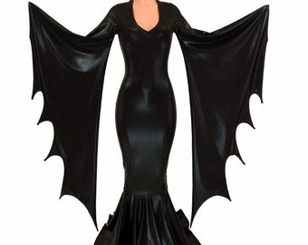 May include: A black, long-sleeved dress with a v-neckline and bat-like wings. The dress has a fitted bodice and a flowing skirt.