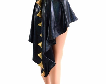 May include: A black, asymmetrical skirt with a shimmering, iridescent finish. Gold triangle accents adorn the draped side. The skirt is displayed on a mannequin, showcasing its unique design and style.