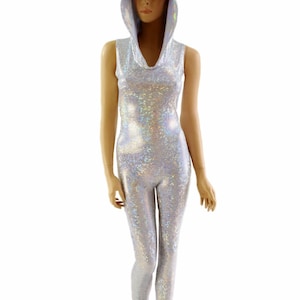 May include: A silver iridescent sleeveless jumpsuit with a hooded neckline. The jumpsuit is made of a stretchy, shiny fabric.