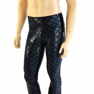 May include: Black leggings with a mermaid scale pattern. The leggings have a flared leg.