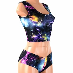 May include: A black crop top and matching shorts with a galaxy print featuring colorful nebulae, stars, and planets.