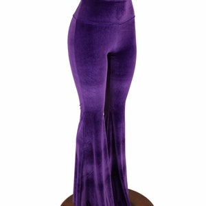 May include: Purple velvet bell bottom pants with a high waist.