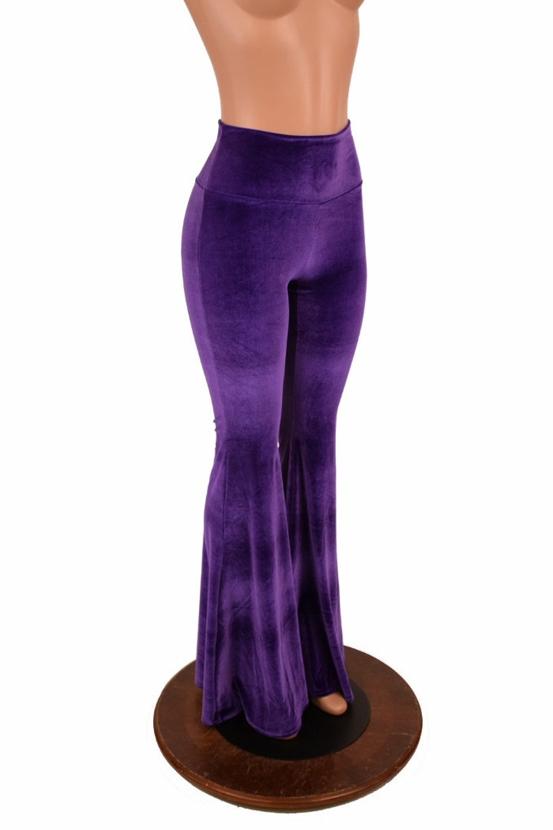 May include: Purple velvet bell bottom pants with a high waist.