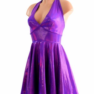 May include: A purple iridescent halter dress with a fitted bodice and a flared skirt.