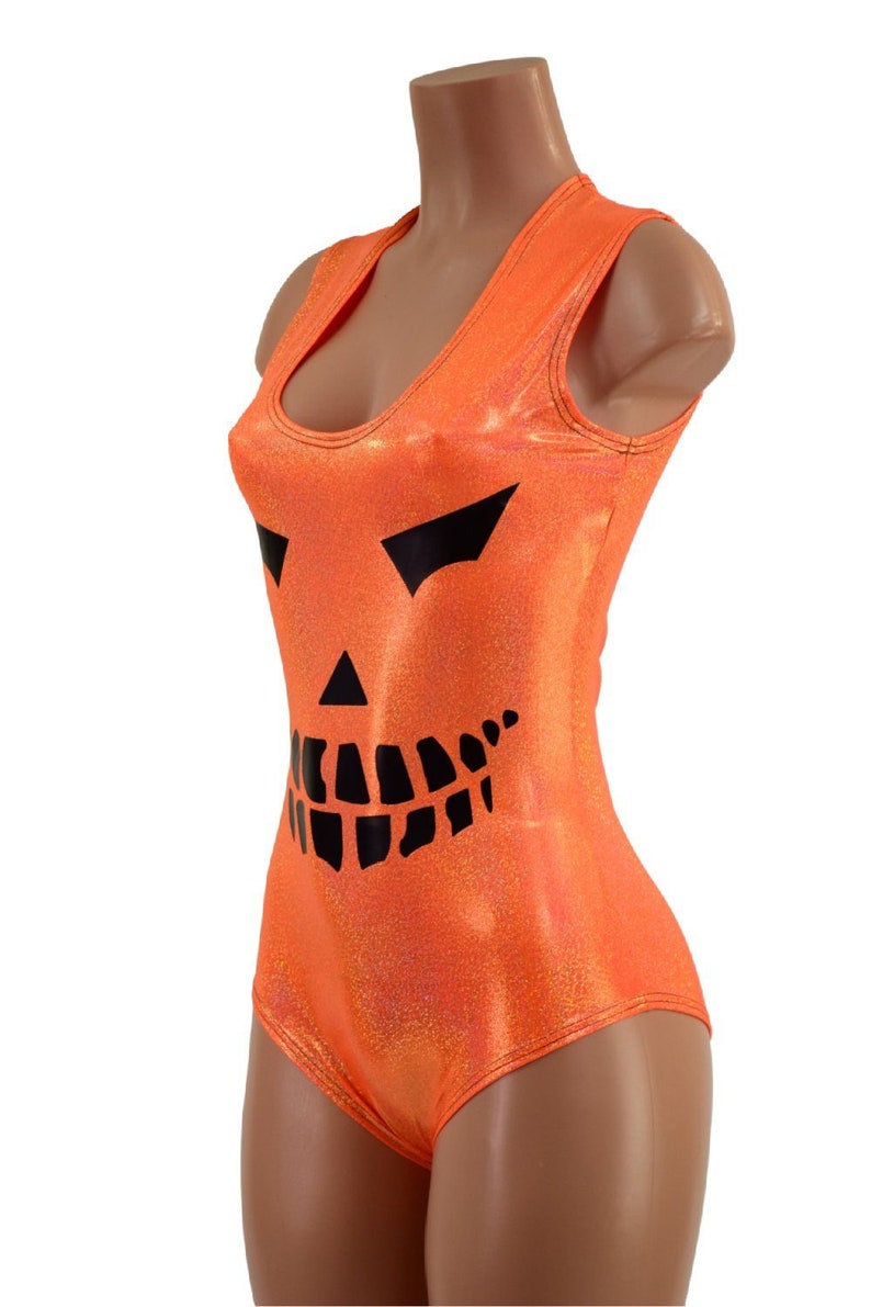 May include: Orange sleeveless bodysuit with a black jack-o'-lantern face printed on the front.