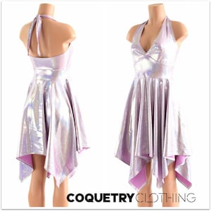 May include: A silver and purple iridescent halter dress with a high neckline and a high-low hemline. The dress is made of a stretchy, shiny fabric and has a fitted bodice and a flowing skirt.