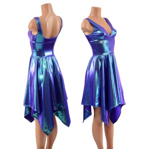 May include: A purple and blue iridescent dress with a V-neckline and a high-low hemline. The dress is sleeveless and has a fitted bodice.