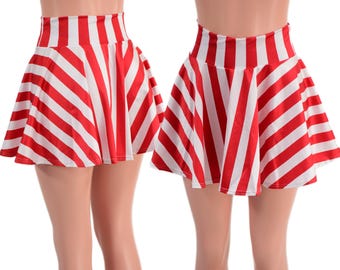 May include: Two red and white striped skater skirts. The skirts have a high waist and a flared, pleated design. The red stripes are wide and alternate with white stripes. The skirts are shown on a white background.
