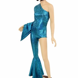 May include: A turquoise one-piece jumpsuit with a flared leg and a single long sleeve. The jumpsuit is made of a sparkly fabric.