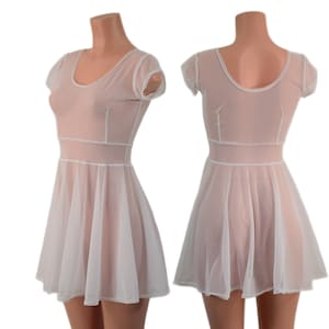 May include: A sheer, light pink dress with a white trim and a flared skirt. The dress features short sleeves and a scoop neckline. The dress is displayed on a mannequin, showcasing the front and back views of the garment.