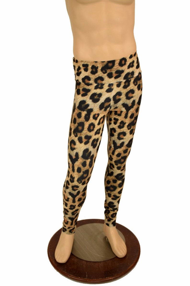 May include: Leopard print leggings in brown and black. The leggings are on a mannequin.