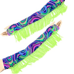 May include: A pair of arm warmers with a vibrant, swirling pattern in shades of blue, pink, green, and yellow. The arm warmers have a neon green fringe along the edge. The fabric is a stretchy material.
