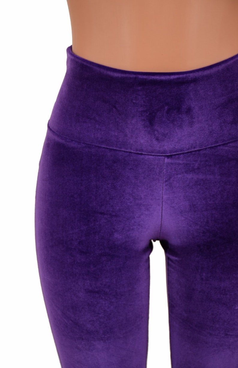 May include: Purple velvet leggings with a high waist.