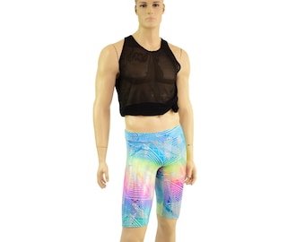 May include: A black mesh tank top with a white geometric print on a blue background. The tank top is worn over a pair of colorful printed shorts.
