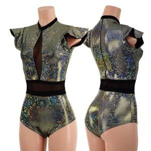May include: A metallic silver bodysuit with a high neckline and short ruffled sleeves. The garment features a sheer mesh panel at the chest and waist. The fabric has a shimmering, iridescent quality, reflecting multiple colors. The bodysuit is designed for dance or performance.