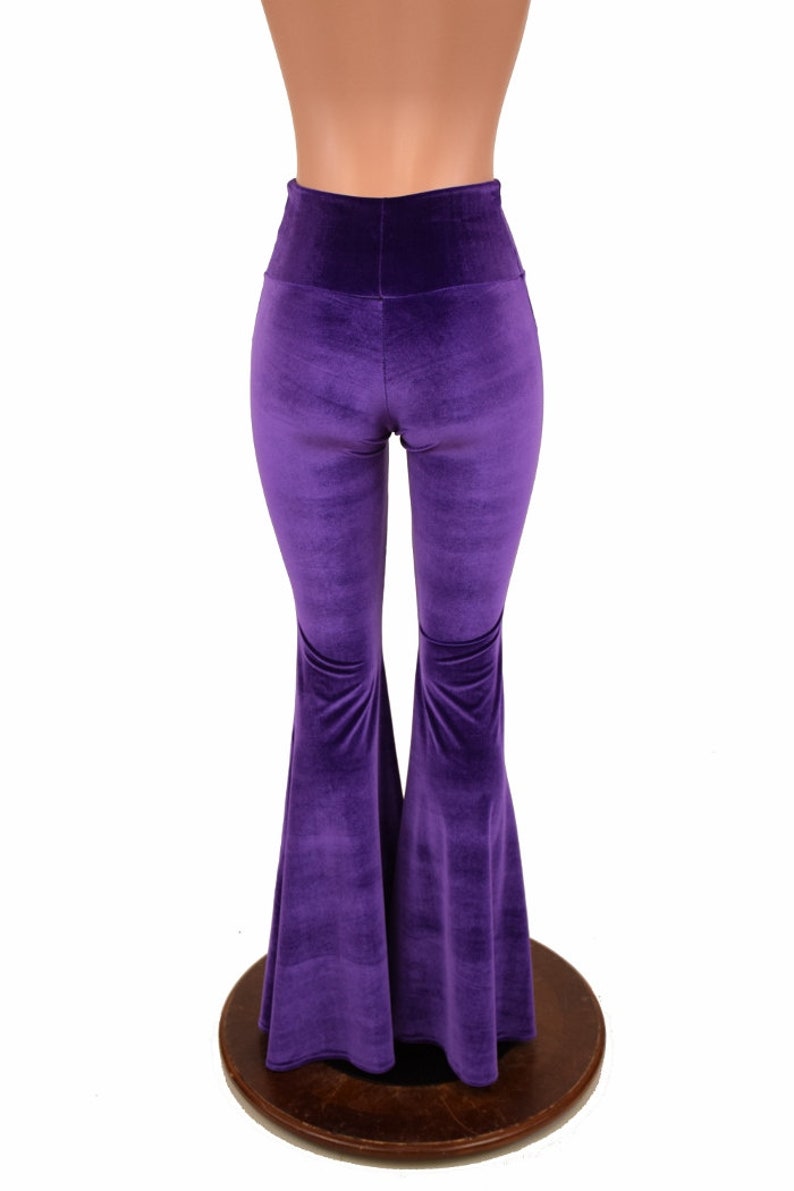 May include: Purple velvet bell bottom pants with a high waist.
