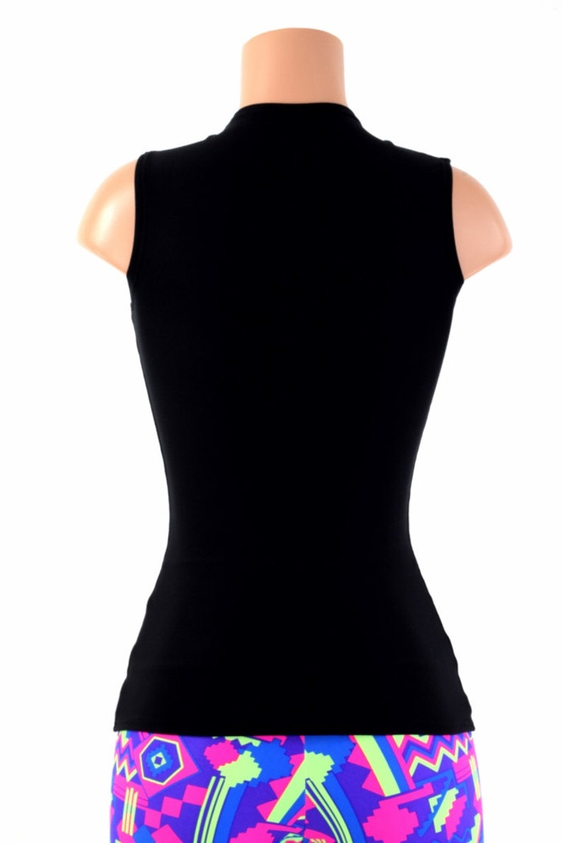May include: A black sleeveless shirt with a mock neck.