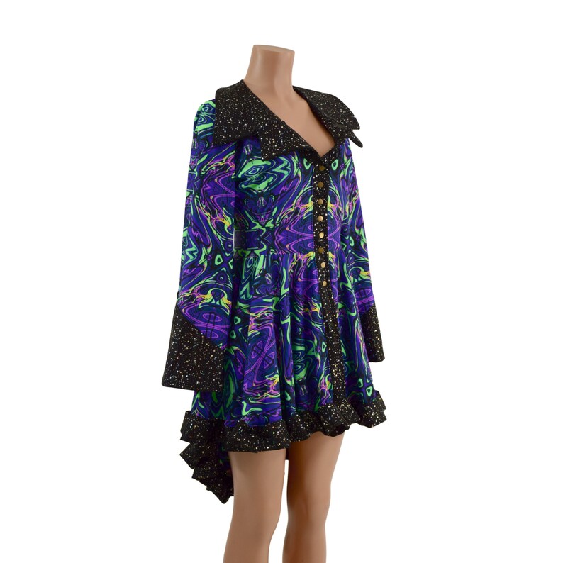 May include: A black and purple dress with a swirling pattern and gold buttons. The dress has a black collar and a ruffled hem.