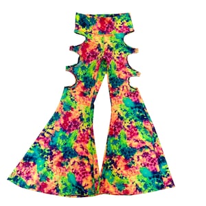 May include: A pair of colorful tie-dye bell bottom pants with cutouts on the sides. The pants are a mix of pink, green, yellow, and blue.