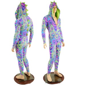 May include: A full-body, hooded jumpsuit with a colorful, swirling pattern in shades of pink, blue, green, and yellow. The jumpsuit has a zipper closure and a green, spiky tail.