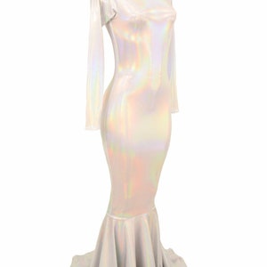 May include: A white iridescent mermaid-style dress with long sleeves and a fitted bodice. The dress has a flowing skirt with a mermaid tail design.