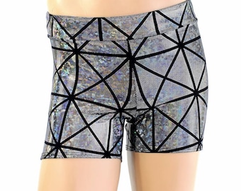 May include: Silver and black geometric print shorts. The shorts have a high waistband and a shiny, holographic appearance. The black geometric pattern creates a striking contrast against the silver background. The shorts are designed for athletic activities.