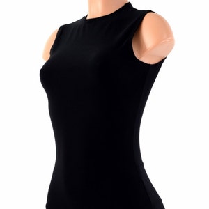 May include: A black sleeveless shirt with a mock neck. The shirt is fitted and has a smooth texture.