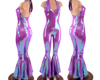 May include: A purple iridescent jumpsuit with a halter neckline and bell bottoms. The jumpsuit is made of a stretchy, shiny fabric.