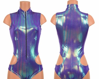 May include: A purple iridescent bodysuit with a zipper up the front and cutouts on the sides. The bodysuit is sleeveless and has a high neck.