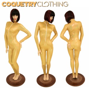 May include: A gold shimmery one-piece jumpsuit with a zipper up the front. The jumpsuit is on a mannequin with a short, dark wig.