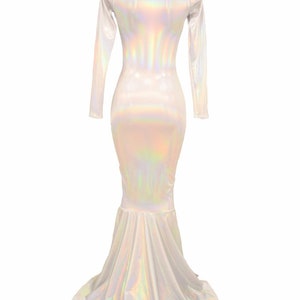 May include: A long-sleeved, iridescent white mermaid-style dress with a fitted bodice and a flowing skirt.