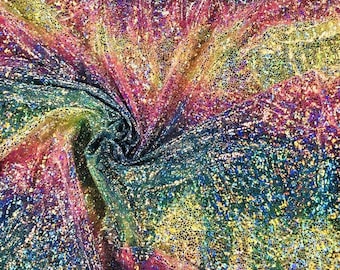 May include: A close-up of iridescent fabric with a rainbow pattern. The fabric has a textured, glittery surface.
