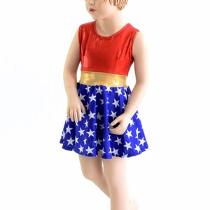 Girls Sleeveless Super Hero Skater Dress with Red Sparkly Jewel Bodice, Gold SJ waistband, and Blue and White Star Flared Hemline 153906