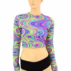 May include: A cropped long-sleeve shirt with a psychedelic swirl pattern in shades of green, blue, pink, and purple.