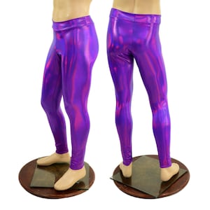 May include: A pair of shiny, purple leggings with a metallic sheen. The leggings are displayed on a mannequin, showcasing their form-fitting design. The fabric reflects light, creating a dynamic visual effect. The leggings are a vibrant shade of purple.
