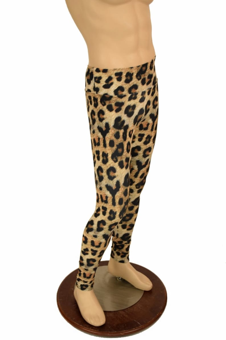 May include: Leopard print leggings in brown and black. The leggings are on a mannequin.