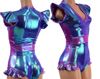 May include: A purple and blue iridescent bodysuit with a ruffled hem and short sleeves. The bodysuit has a V-neck and a pink trim.